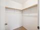 This closet has carpeted floors, a shelf, and a door leading to the interior at 5757 W Eugie Ave # 1080, Glendale, AZ 85304