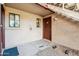 Condo entrance featuring a private patio with front door access and neutral exterior paint at 5757 W Eugie Ave # 1080, Glendale, AZ 85304