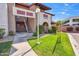 Condominium exterior showcasing well-maintained grounds and convenient stair access at 5757 W Eugie Ave # 1080, Glendale, AZ 85304