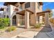 Condo exterior view showcasing a cozy gated patio area and beautiful desert landscaping at 5757 W Eugie Ave # 1080, Glendale, AZ 85304
