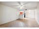 Spacious living room with tile flooring, ceiling fan, and neutral paint at 5757 W Eugie Ave # 1080, Glendale, AZ 85304