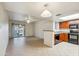 Bright living room with tile flooring, sliding glass doors, and open to the kitchen at 5757 W Eugie Ave # 1080, Glendale, AZ 85304