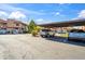 Covered parking with multiple parking spots and a view of the exterior at 5757 W Eugie Ave # 1080, Glendale, AZ 85304
