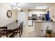 Cozy dining area with a glass-top table and chairs, flowing into a bright kitchen at 625 S Westwood -- # 121, Mesa, AZ 85210