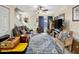 Open living room featuring neutral tones, area rug, and bright natural light at 625 S Westwood -- # 121, Mesa, AZ 85210