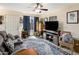 Inviting living room with a comfortable sofa, area rug, and natural light at 625 S Westwood -- # 121, Mesa, AZ 85210