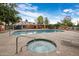 Community pool and spa with lounge chairs for relaxation at 625 S Westwood -- # 121, Mesa, AZ 85210