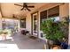 Relaxing back porch with ceiling fans and ample space for outdoor seating at 639 N 110Th Pl, Mesa, AZ 85207