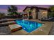 Stunning pool in backyard oasis with steps, lighting and plenty of space for relaxation and fun at 639 N 110Th Pl, Mesa, AZ 85207