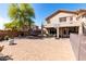 Large backyard with mature trees, basketball court and entertainment patio at 639 N 110Th Pl, Mesa, AZ 85207