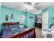 Comfortable bedroom featuring a ceiling fan, furniture and nautical themed decor at 639 N 110Th Pl, Mesa, AZ 85207