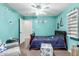 Cozy bedroom featuring a ceiling fan, furniture and nautical themed decor at 639 N 110Th Pl, Mesa, AZ 85207