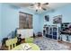 Bright, colorful bedroom with playful decor, ample storage, and plenty of space for activities and imagination at 639 N 110Th Pl, Mesa, AZ 85207