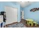 Another view of the bright, colorful bedroom with playful decor, ample storage, and space for activities at 639 N 110Th Pl, Mesa, AZ 85207