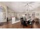Dining room features a table with seating for six and a large arched window that offers natural light at 639 N 110Th Pl, Mesa, AZ 85207
