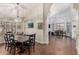 Open-concept dining area featuring high ceilings, a chandelier, and a view to kitchen at 639 N 110Th Pl, Mesa, AZ 85207