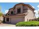 The home features classic lines and a two car garage at 639 N 110Th Pl, Mesa, AZ 85207