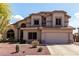 Charming two-story home with a two-car garage, desert landscaping, and a welcoming entrance at 639 N 110Th Pl, Mesa, AZ 85207