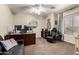 A well-appointed home office featuring a modern desk, comfortable chair, and ample natural light from a large window at 639 N 110Th Pl, Mesa, AZ 85207