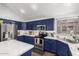Kitchen featuring stainless steel appliances, blue cabinets, and quartz countertops at 639 N 110Th Pl, Mesa, AZ 85207