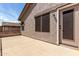 An open patio, offering a great outdoor space for entertaining or relaxing with views of a neighboring house at 639 N 110Th Pl, Mesa, AZ 85207