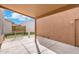 Covered back patio and access to backyard with artificial turf at 6811 W Aire Libre Ave, Peoria, AZ 85382