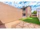 Backyard with patio, stone pavers, and artificial turf at 6811 W Aire Libre Ave, Peoria, AZ 85382