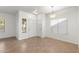 Bright entryway featuring tile floors, decorative lighting, and a window bringing natural light into the welcoming space at 6811 W Aire Libre Ave, Peoria, AZ 85382