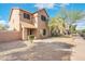 Charming two-story house features a well-manicured front yard with low-maintenance desert landscaping and walkway at 6811 W Aire Libre Ave, Peoria, AZ 85382