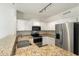 Kitchen featuring stainless steel appliances and granite counters at 6811 W Aire Libre Ave, Peoria, AZ 85382