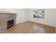Open living area with tile flooring, a fireplace, bright natural light, and neutral walls, perfect for relaxing at 6811 W Aire Libre Ave, Peoria, AZ 85382