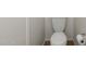 A standard white toilet with a roll of toilet paper at 6811 W Aire Libre Ave, Peoria, AZ 85382