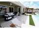 Backyard features a covered patio, outdoor seating, a hot tub, and a pool for a relaxing oasis at 7158 E Posada Ave, Mesa, AZ 85212