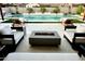 This backyard features a pool, outdoor seating, and a fire pit perfect for entertaining guests at 7158 E Posada Ave, Mesa, AZ 85212