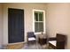Charming entryway featuring a seating area and a well-maintained landscape at 7158 E Posada Ave, Mesa, AZ 85212