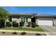 Charming home featuring desert landscaping, gray stucco, a tile roof, and a two-car garage at 7158 E Posada Ave, Mesa, AZ 85212