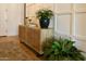 Elegant foyer with neutral decor, hardwood flooring, and decorative console table at 7158 E Posada Ave, Mesa, AZ 85212