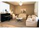 Inviting living room with piano, neutral furniture and carpet at 7158 E Posada Ave, Mesa, AZ 85212