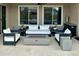This outdoor patio seating area is perfect for relaxing with a fire pit and comfortable furniture at 7158 E Posada Ave, Mesa, AZ 85212