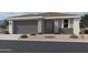 Charming home with a neutral color palette, well-maintained landscaping, and a convenient two-car garage at 7707 W Avenida Del Rey --, Peoria, AZ 85383