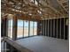 An unfinished living room shows the frame and sliding glass doors ready for the next phase of construction at 7707 W Avenida Del Rey --, Peoria, AZ 85383