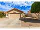Charming single-story home featuring a two-car garage and desert landscaping at 7822 W Mcrae Way, Glendale, AZ 85308