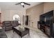 Bright living room featuring vaulted ceiling, neutral tones and access to the kitchen at 7822 W Mcrae Way, Glendale, AZ 85308