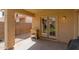 Covered patio area with a small outdoor cooking station, leading to interior at 7822 W Mcrae Way, Glendale, AZ 85308