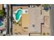 Aerial view of a private backyard oasis with a pool, patio, and well-maintained desert landscaping in an established neighborhood at 809 N 95Th St, Mesa, AZ 85207