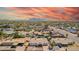 Sweeping aerial panorama highlighting a residential area featuring a home with a backyard pool, patio, and desert landscaping at 809 N 95Th St, Mesa, AZ 85207