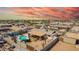 High angle, residential neighborhood featuring a home with a backyard pool, patio, desert landscaping, and privacy features at 809 N 95Th St, Mesa, AZ 85207