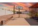 Spacious backyard featuring a basketball court and low-maintenance desert landscaping at 809 N 95Th St, Mesa, AZ 85207