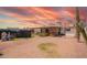Large backyard with covered patio, basketball court, and potential for landscaping at 809 N 95Th St, Mesa, AZ 85207