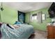 Cozy bedroom with green walls and soft bedding at 809 N 95Th St, Mesa, AZ 85207